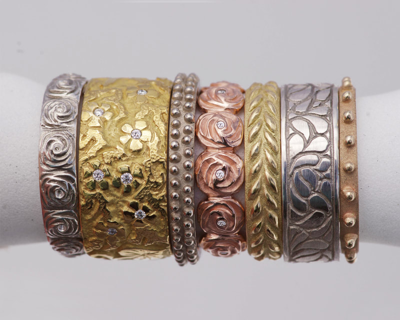 Collage of unique, hand carved gold rings by Kristina Backes of Tinken Jewelry