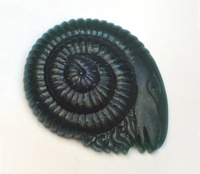 Sculptural astrological carving in wax of an aries head intended for lost wax casting process. This is a prototype carving for cufflinks.